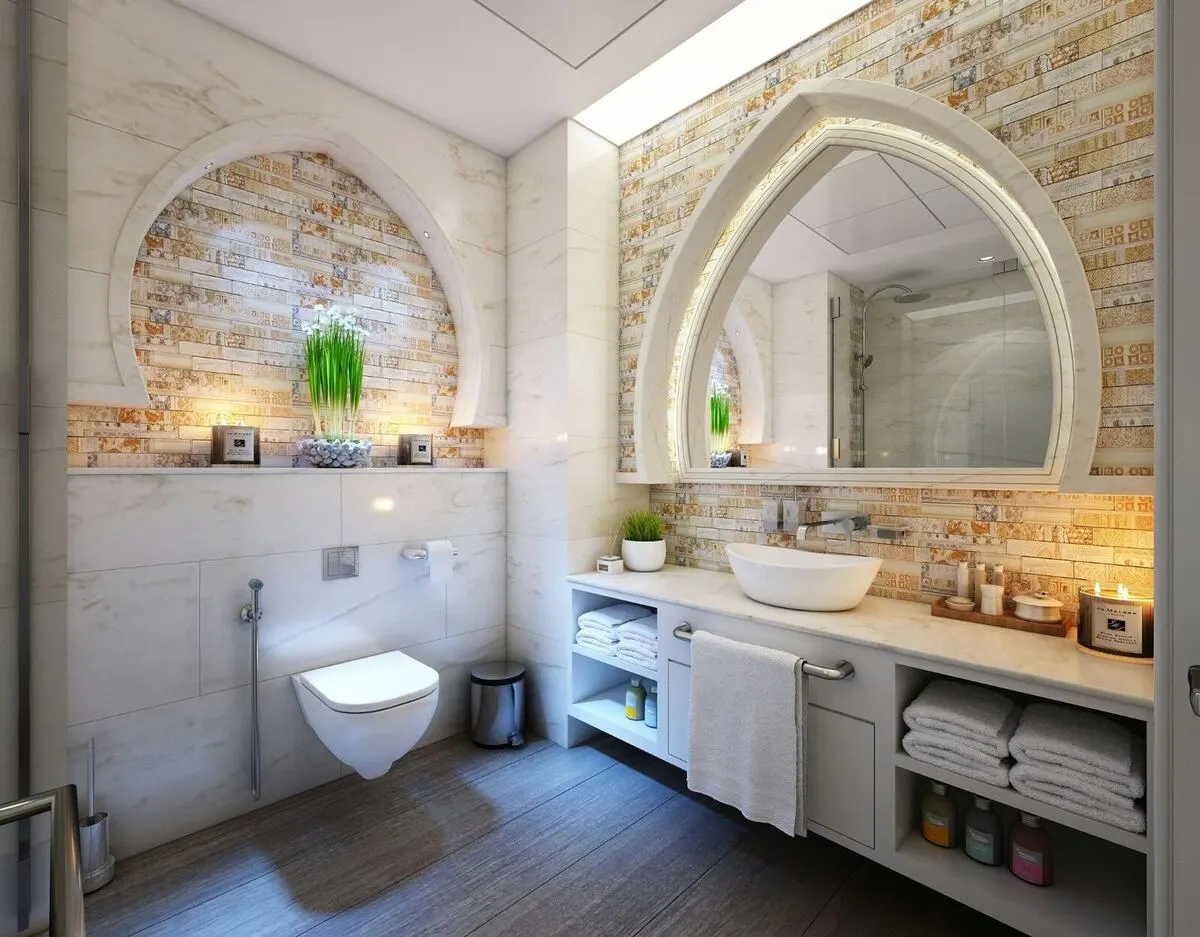Mediterranean bathroom with arched niche mosaic accent tile and vessel sink