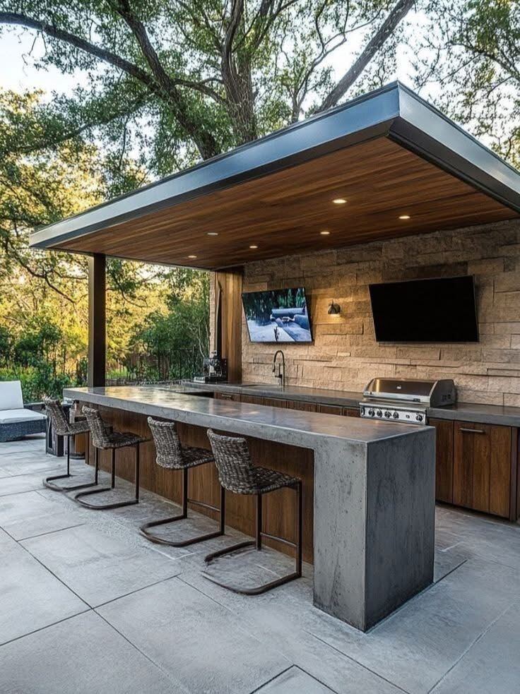 Contemporary outdoor kitchen bar stone wall TV by ELSO