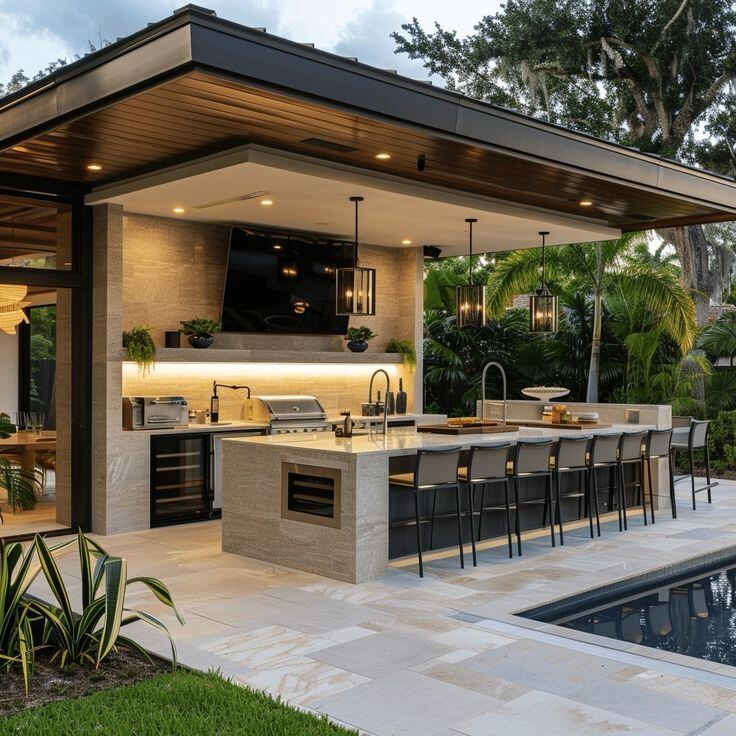 Luxury poolside outdoor kitchen covered pavilion by ELSO