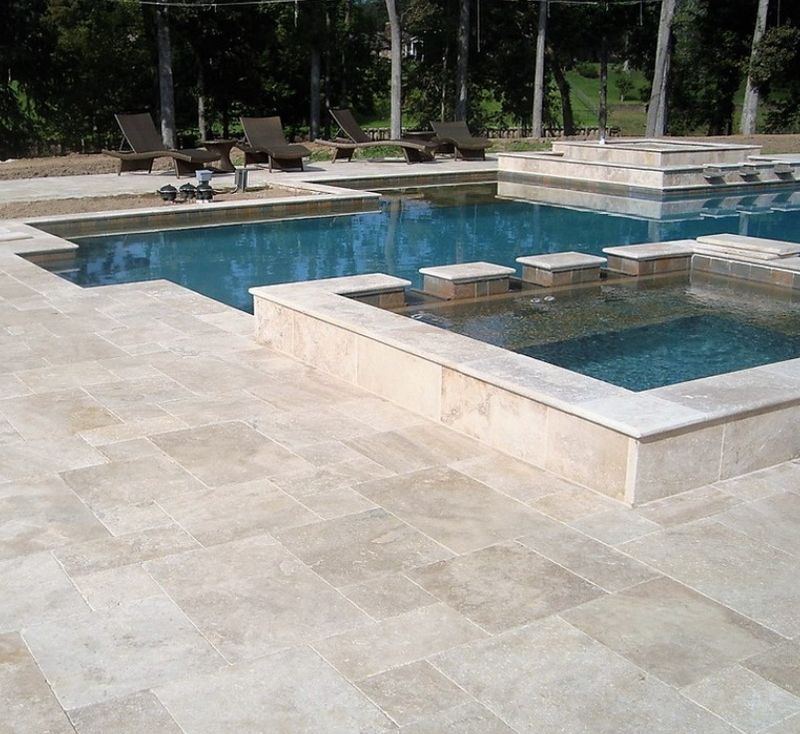 Travertine pool deck in Rockledge FL by ELSO Contracting