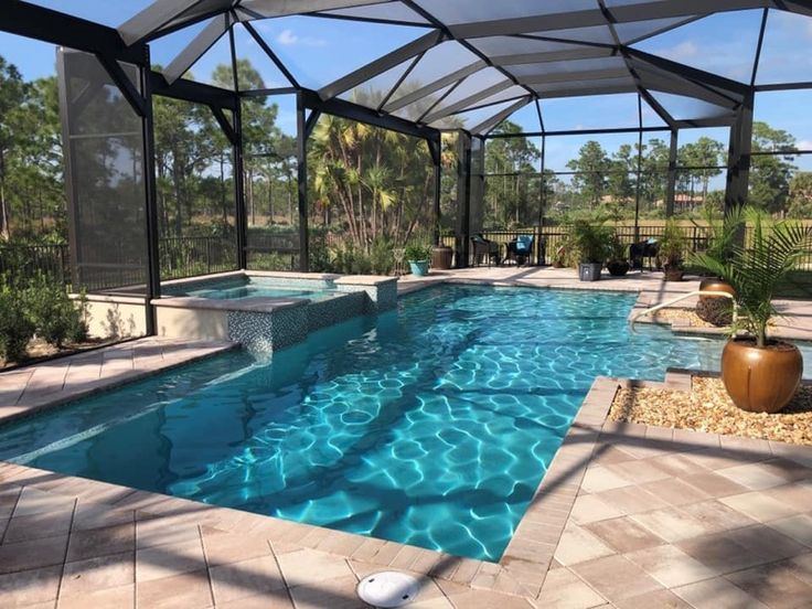 Pool enclosure with spa in Rockledge FL by ELSO Contracting