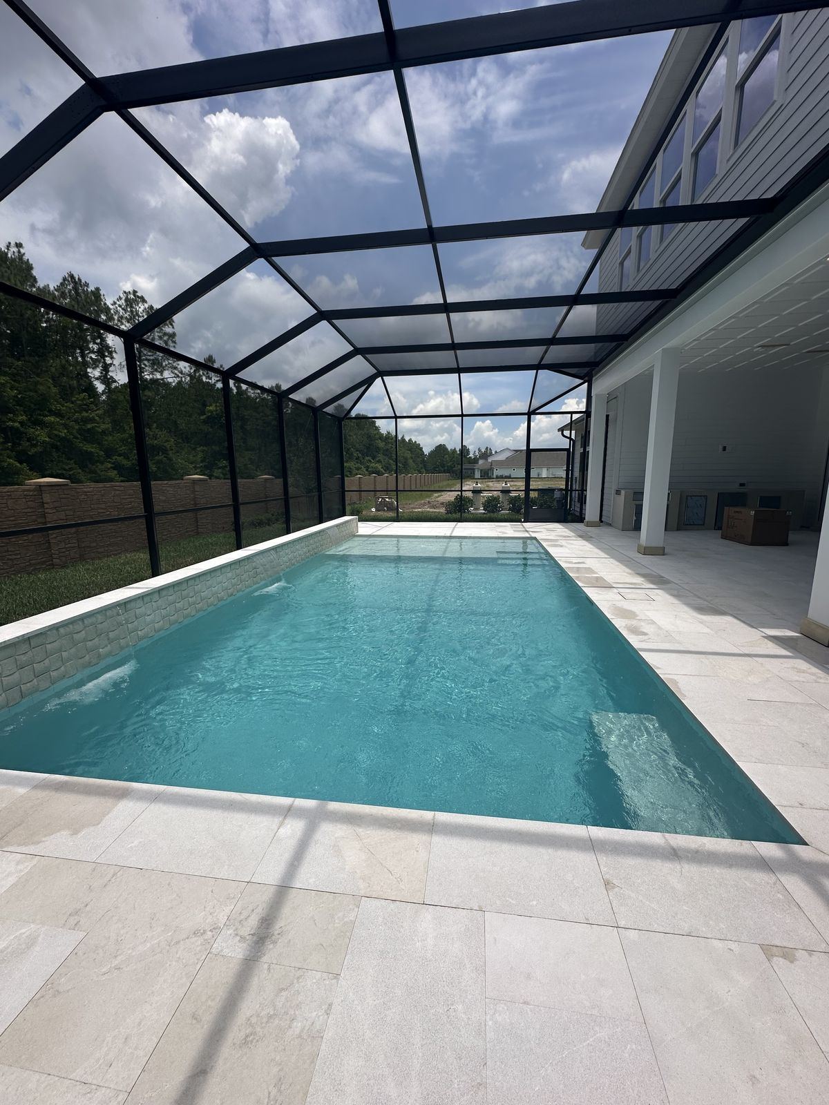 Travertine pool enclosure in Rockledge FL by ELSO Contracting